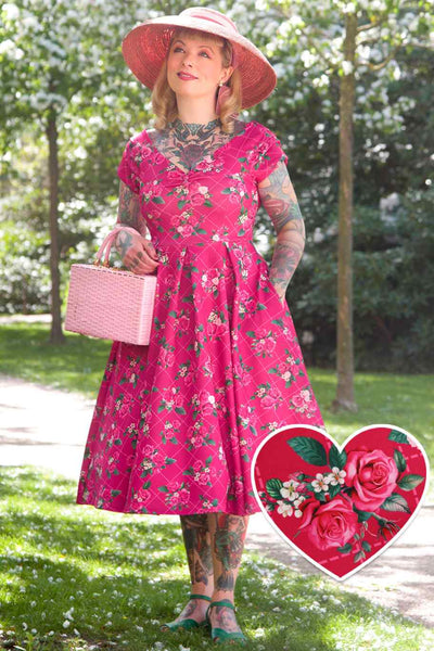 A model wearing Pink Floral Vine Off Shoulder Dress