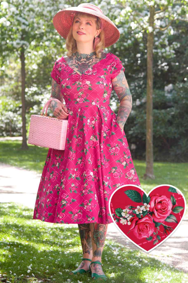 A model wearing Pink Floral Vine Off Shoulder Dress