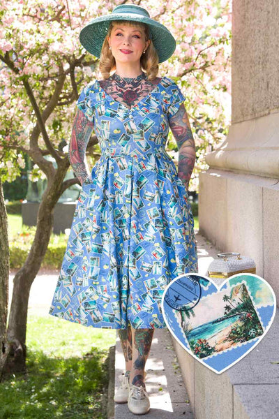 A model wearing Postage Stamp Off Shoulder Dress In Blue