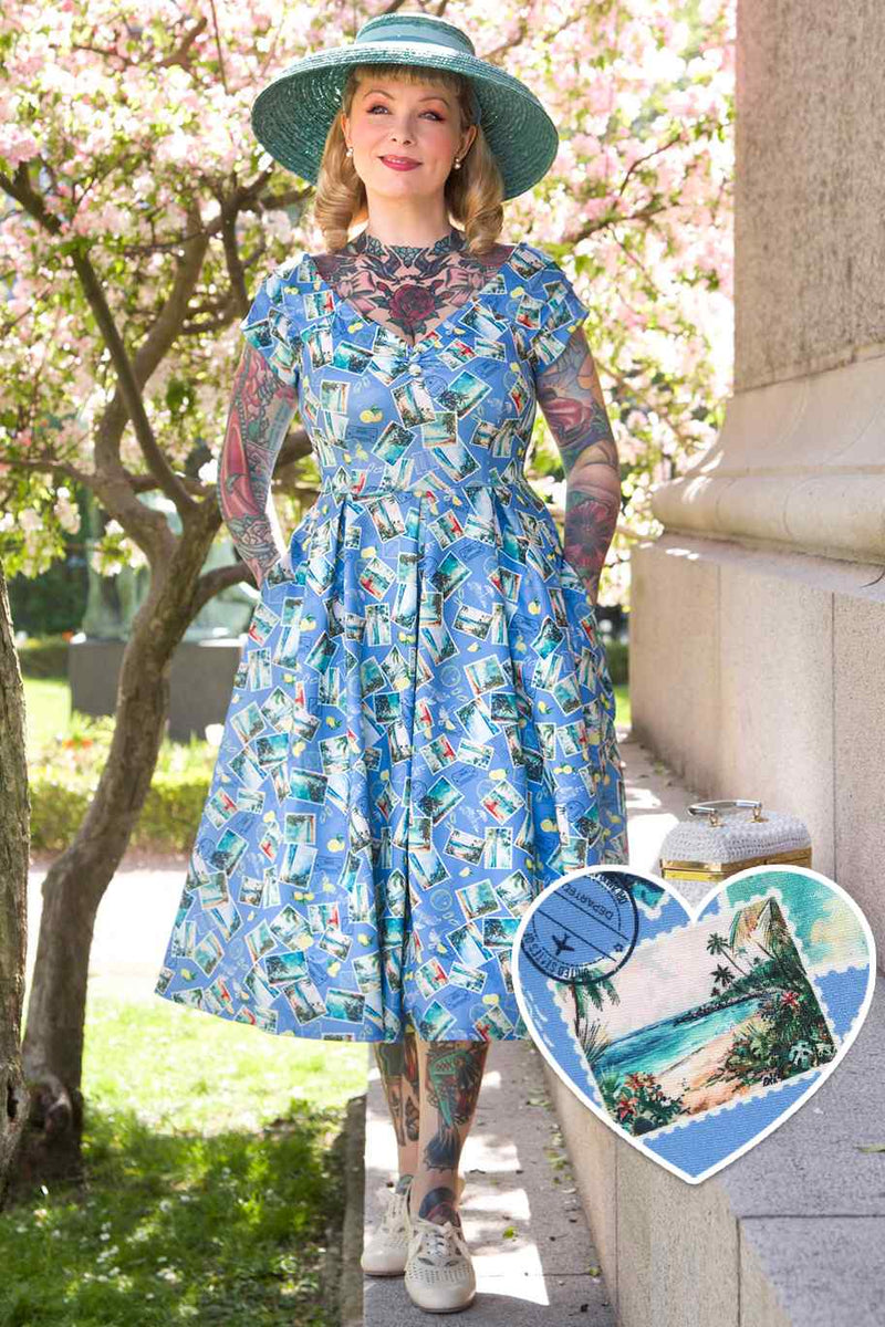 A model wearing Postage Stamp Off Shoulder Dress In Blue