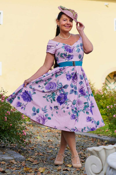 A lady wearing a Lily Purple Rose Off Shoulder Midi Dress