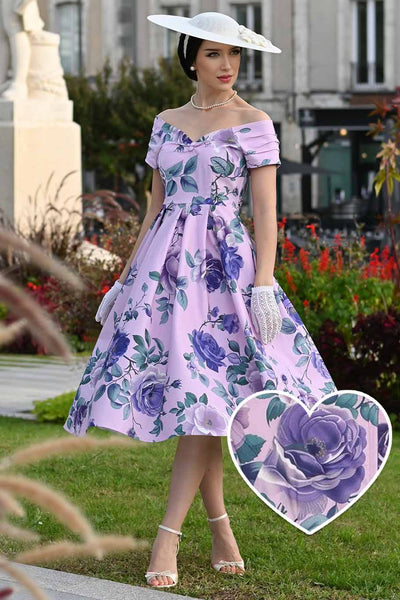 A lady wearing a Lily Purple Rose Off Shoulder Midi Dress