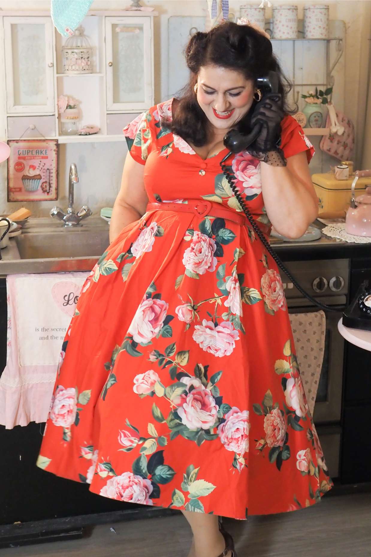 A lady wearing a Lily Red Rose Off Shoulder Midi Dress