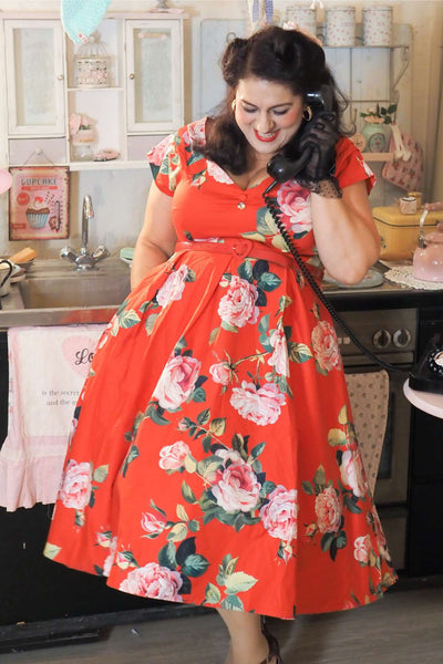 A lady wearing a Lily Red Rose Off Shoulder Midi Dress
