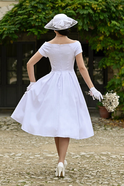 A lady wearing a Lily White Off Shoulder Midi Dress