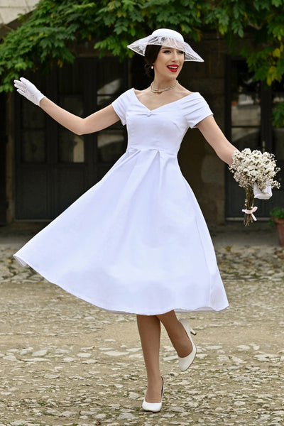 A model wearing a Lily White Off Shoulder Midi Dress
