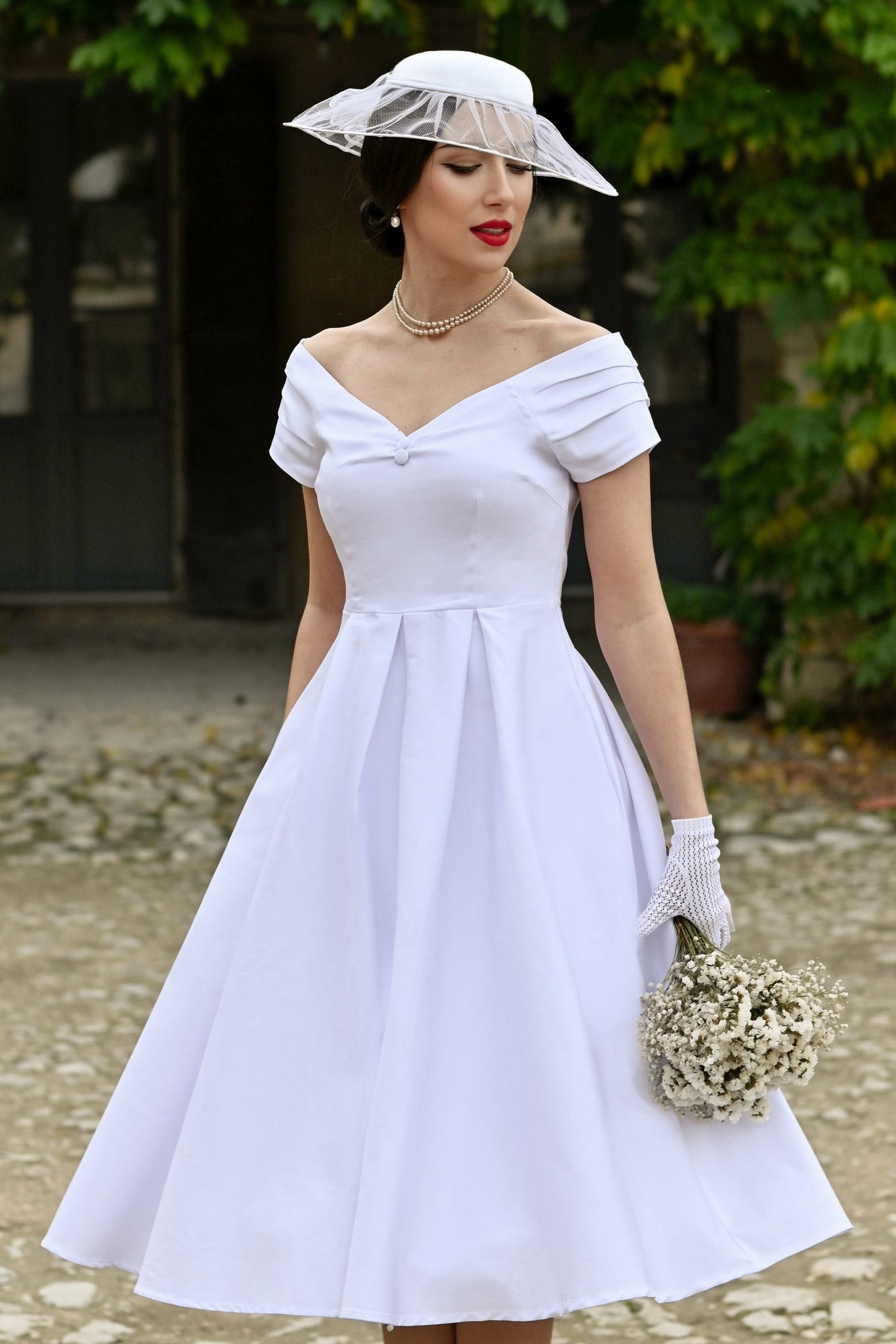 A model wearing a Lily White Off Shoulder Midi Dress
