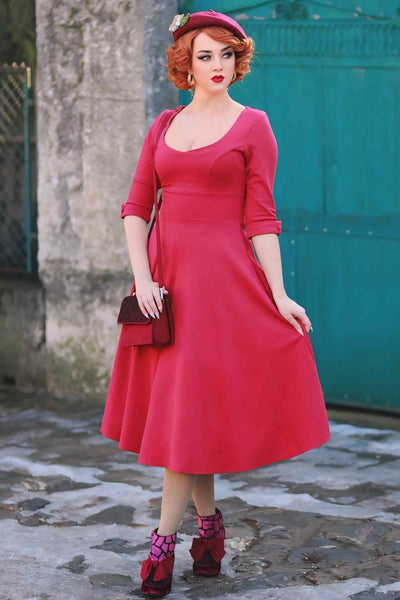 A lady wearing a Long Sleeved Burgundy Midi Dress