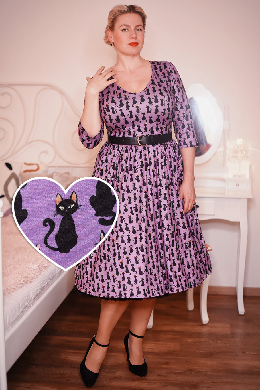 Customer wears our long sleeved flared dress, in purple black dress print