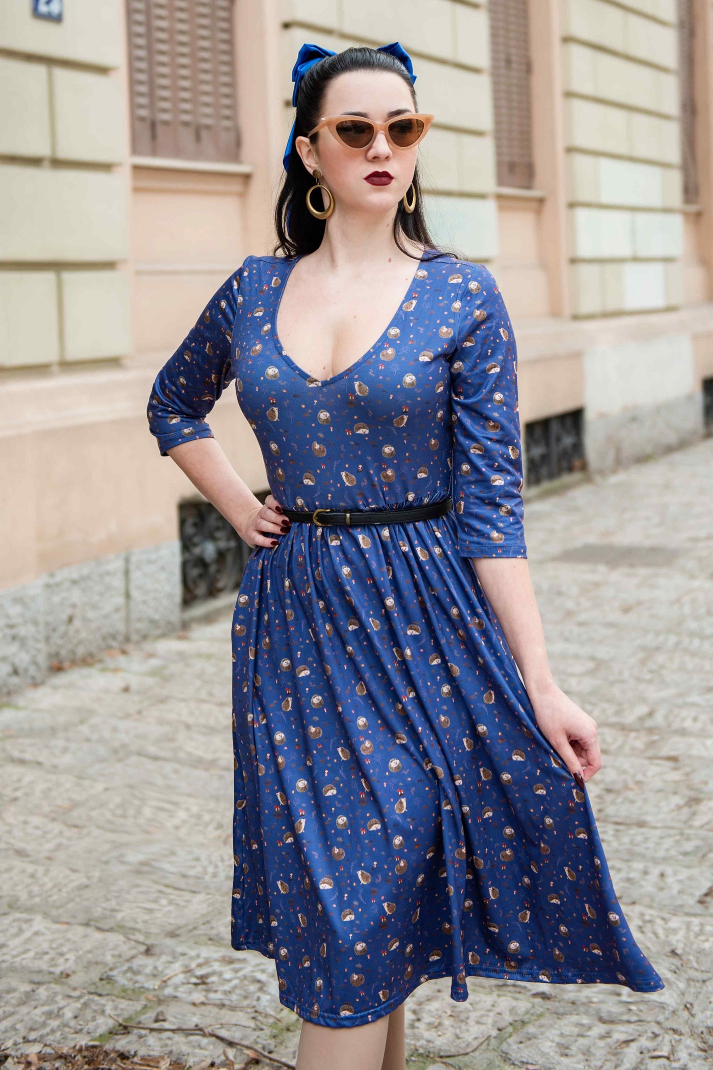 A lady wearing a Long Sleeved Purple Hedgehog Dress