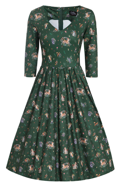 Front view of dark green, long sleeved, flared dress, in woodland animal print