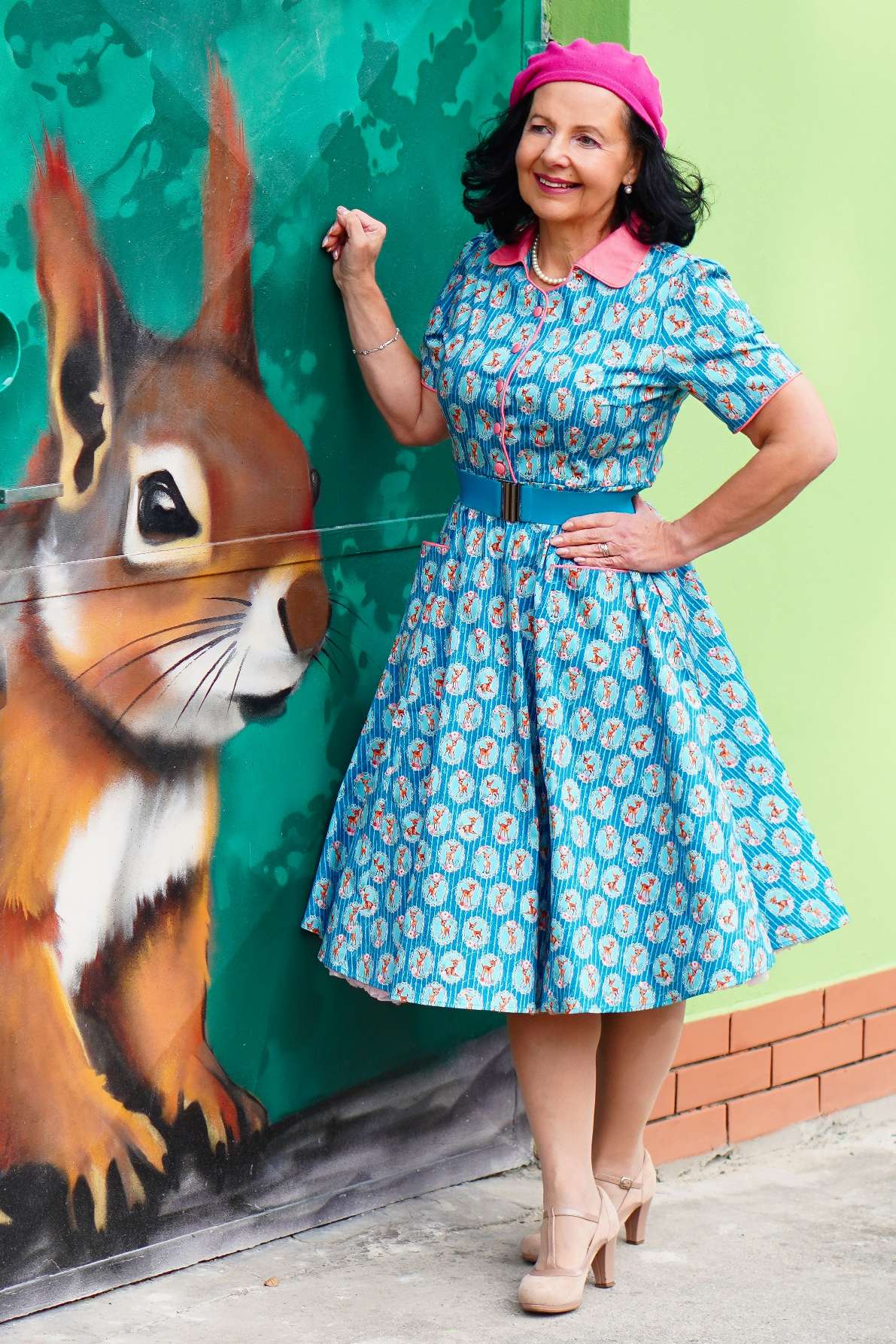 A lady wearing a Mabel Baby Deer Midi Shirt Dress In Blue
