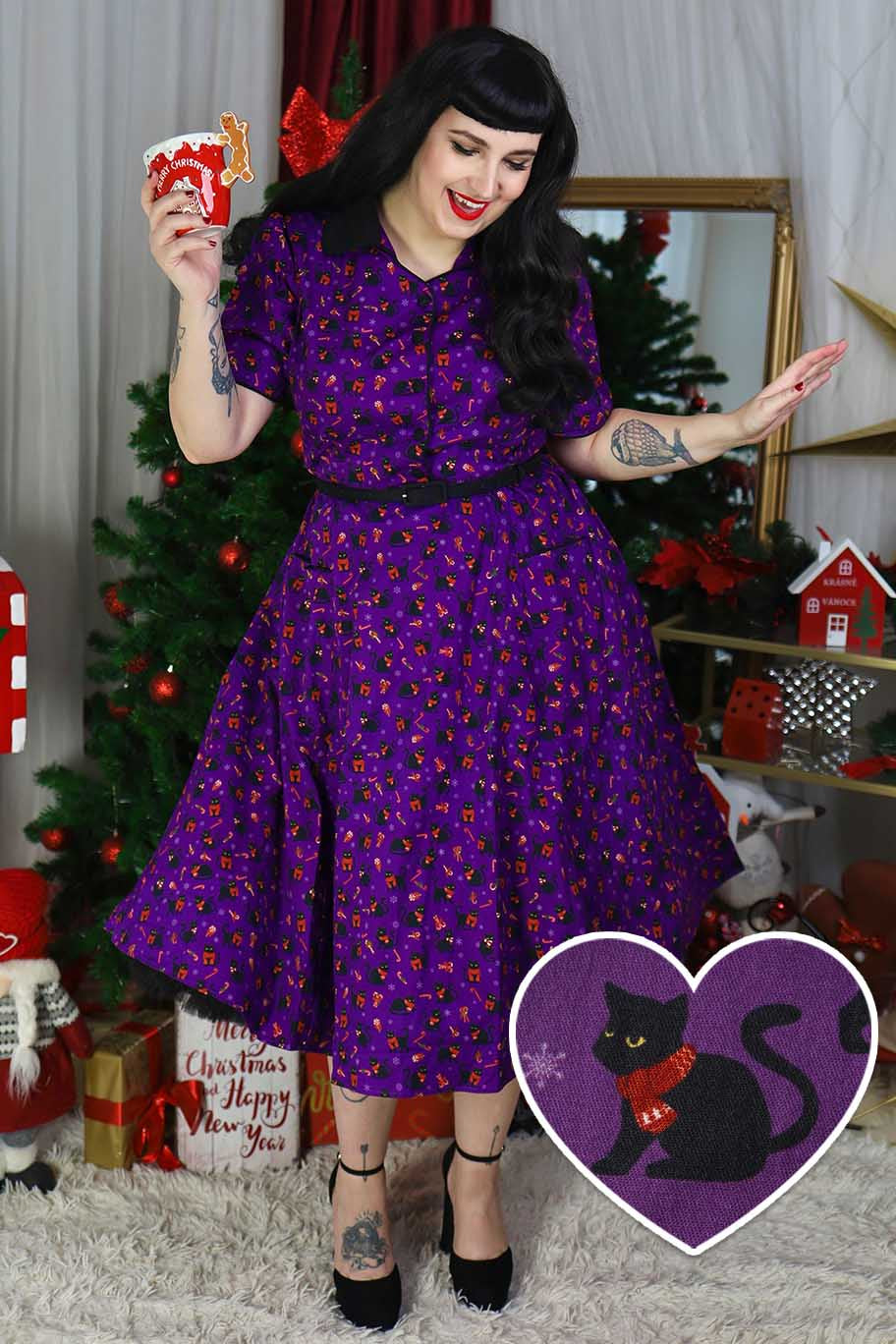 A model wearing a Mabel Festive Cat Shirt Dress In Purple