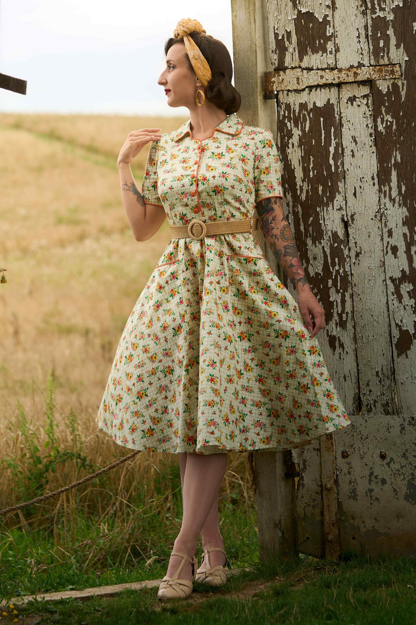 A lovely model wearing a Mabel Retro Floral Midi Shirt Dress