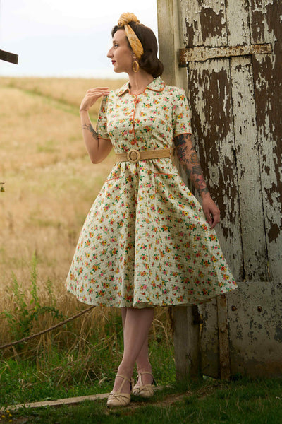 A lovely model wearing a Mabel Retro Floral Midi Shirt Dress