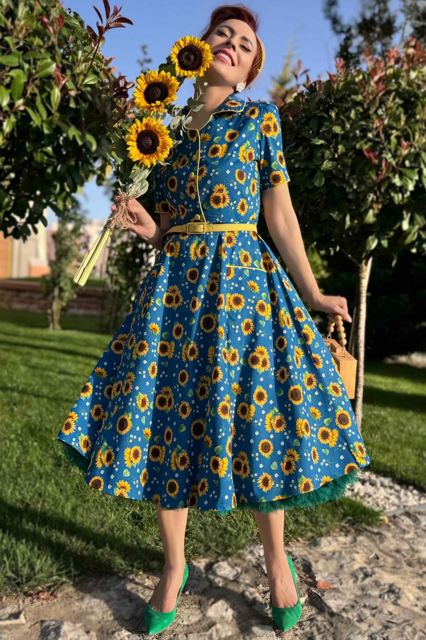 A lady in Mabel Sunflower Midi Shirt Dress In Blue