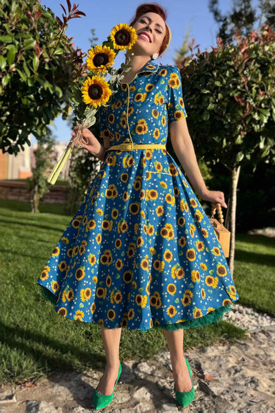 A lady in Mabel Sunflower Midi Shirt Dress In Blue