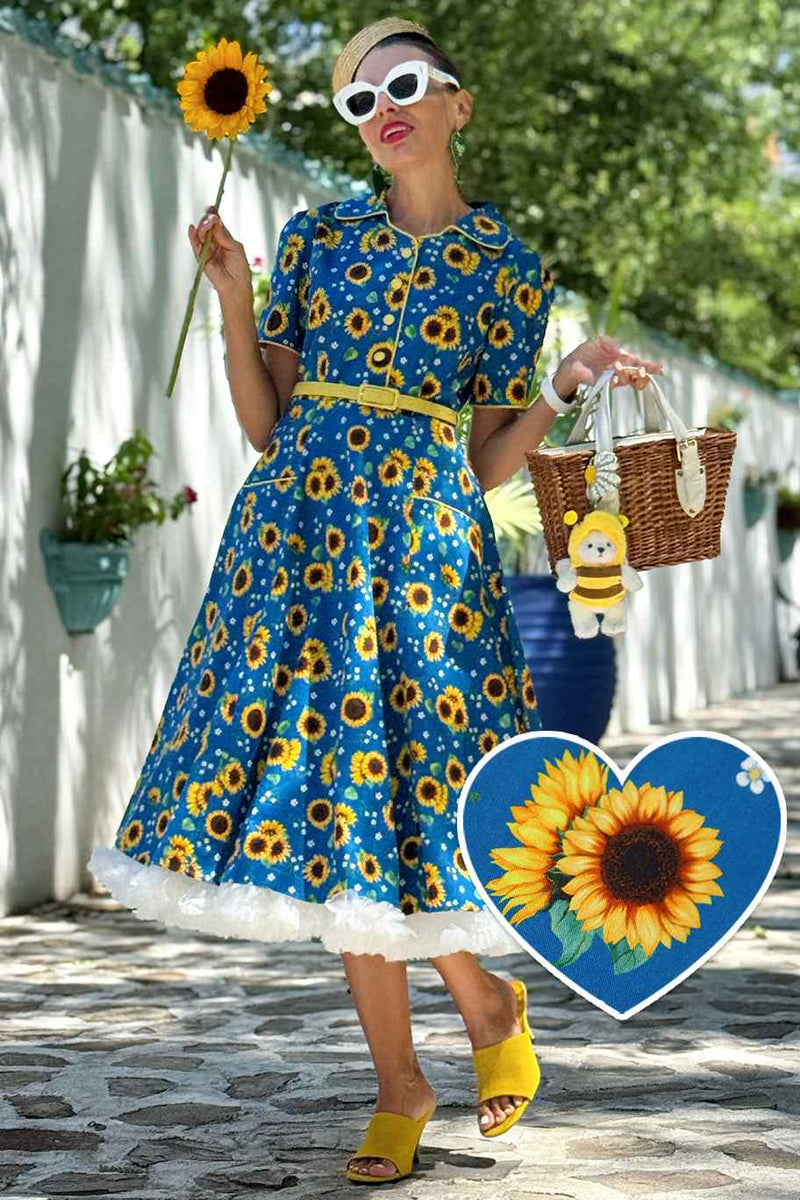 A model in Mabel Sunflower Midi Shirt Dress In Blue