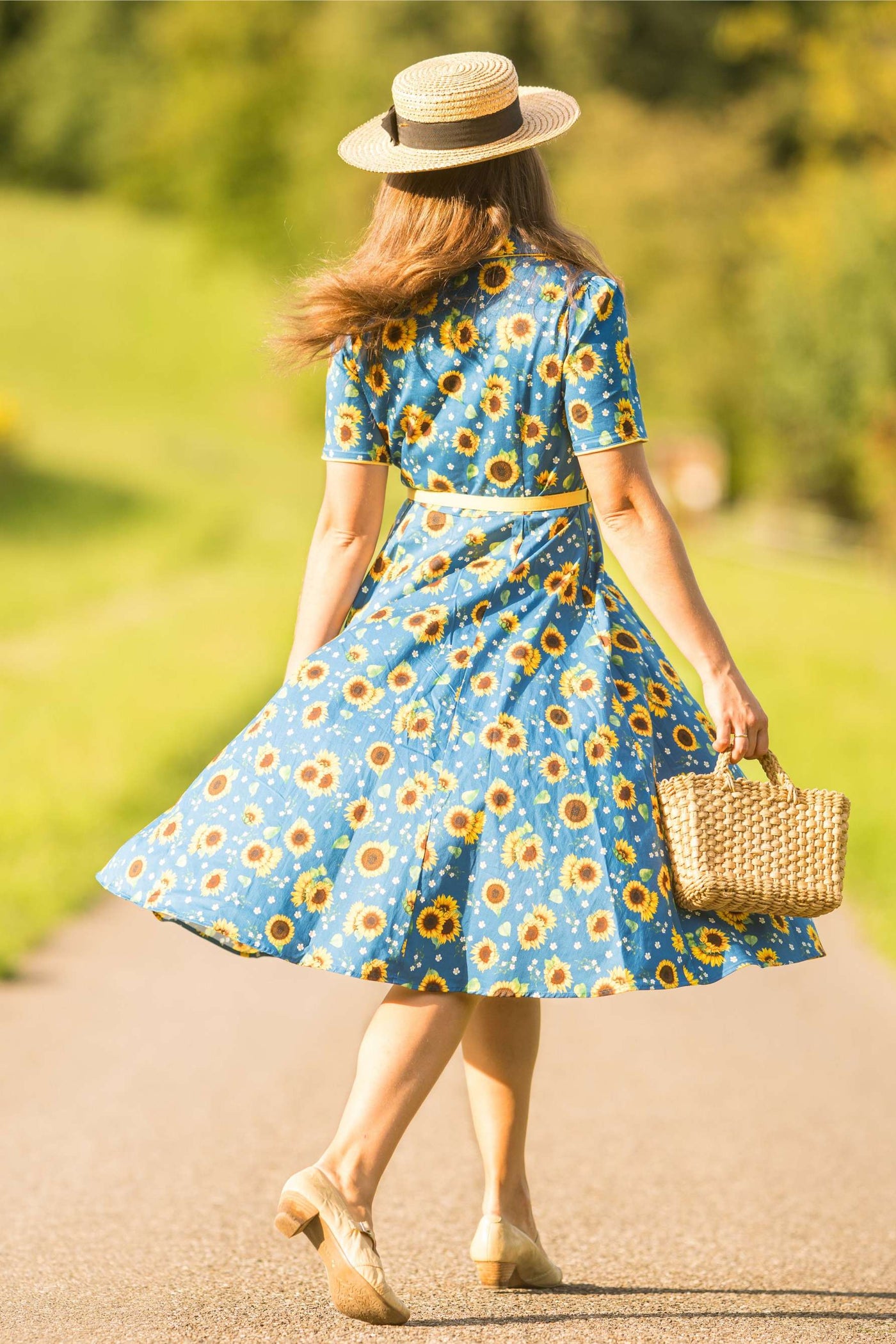 A lovely model wearing Mabel Sunflower Midi Shirt Dress In Blue