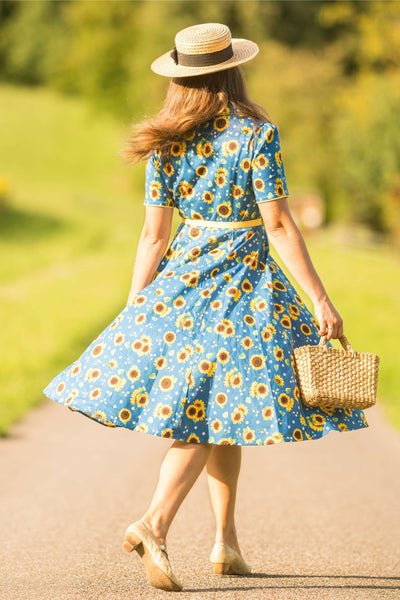 A lovely model wearing Mabel Sunflower Midi Shirt Dress In Blue