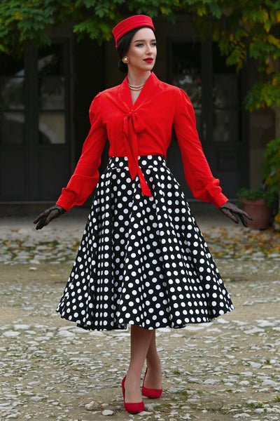A charming model wearing a Margaret Long Sleeved Blouse In Red