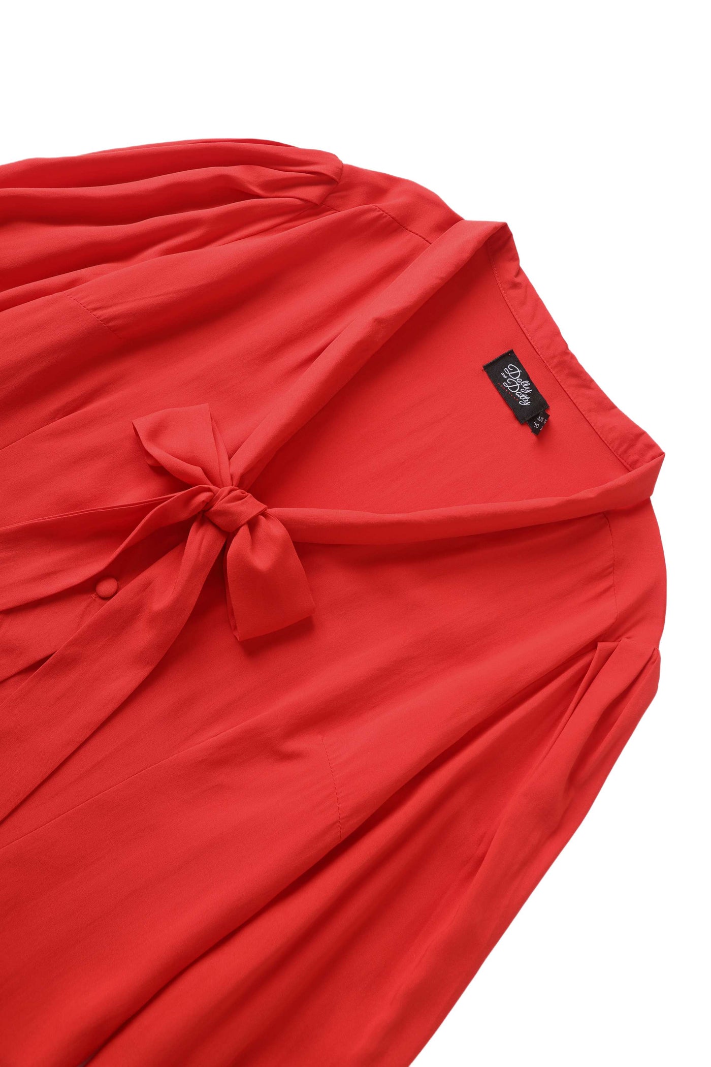 Close up view the neckline of Margaret Long Sleeved Blouse In Red