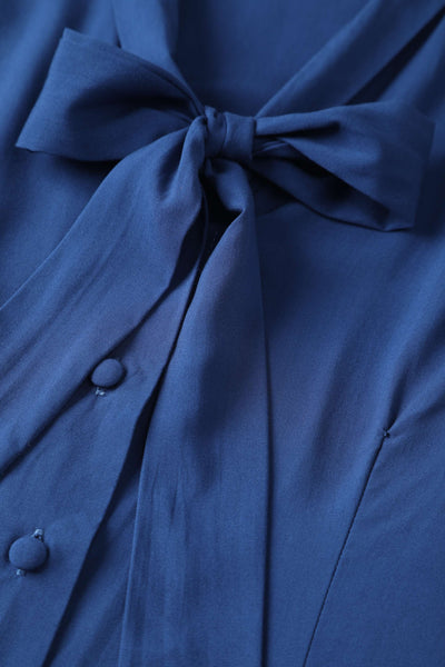 A bow tie collar of Margaret Long Sleeved Blouse In Royal Blue