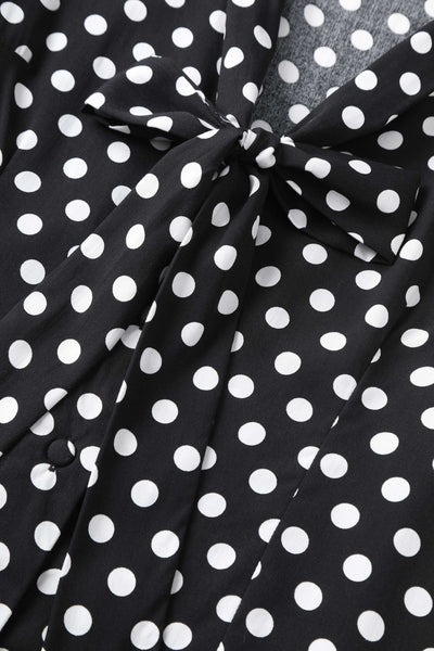 A bow tie of Margaret Polka Dot Long Sleeved Blouse In Black