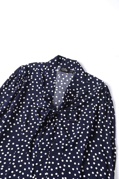 Close up view the top of Margaret Polka Dot Long Sleeved Blouse In Dark Blue