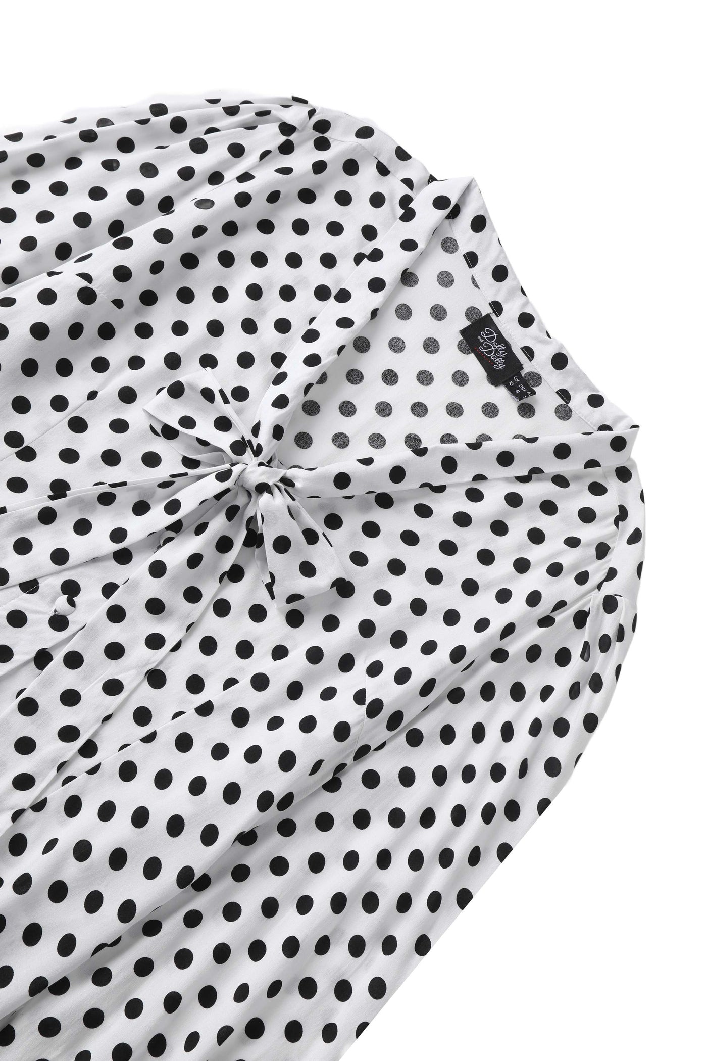 Close up view the neckline of Margaret Polka Dot Long Sleeved Blouse In White