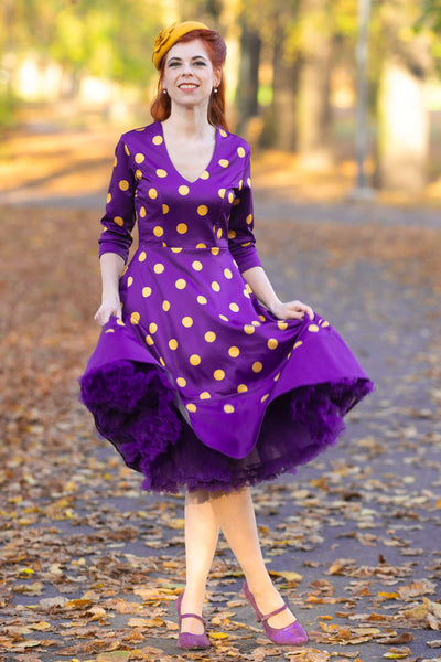 A lady wearing a Maria Purple Circle Dress With Polka Dots