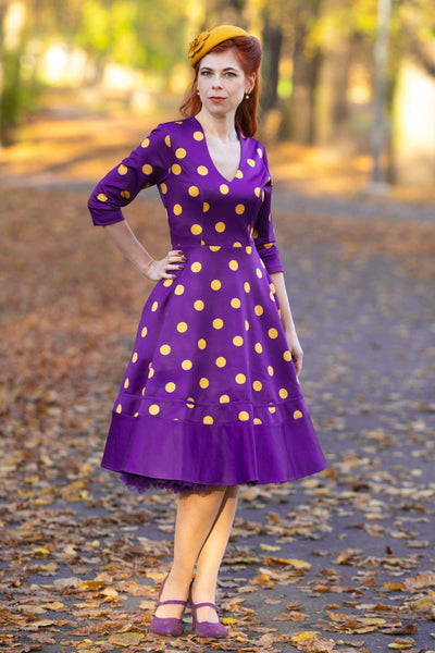 A model wearing a Maria Purple Circle Dress With Polka Dots