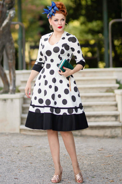 A model wearing a Maria White Circle Dress With Polka Dots