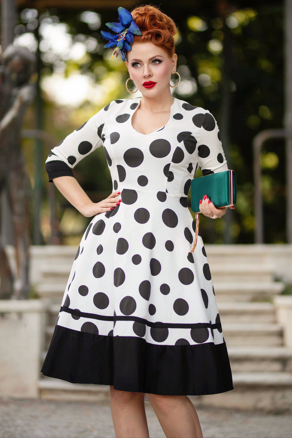 A lovely model wearing a Maria White Circle Dress With Polka Dots