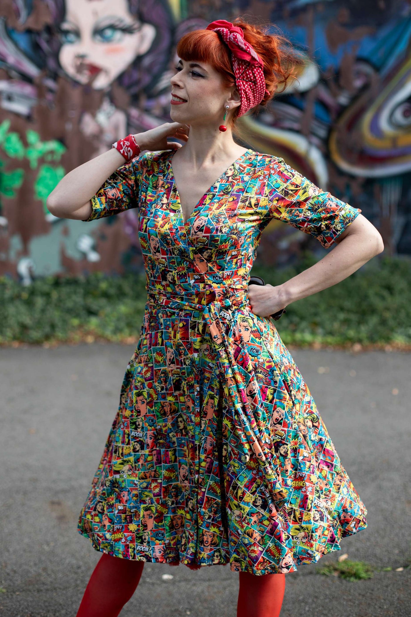 A graceful model wearing a Matilda Comic Wrap Dress