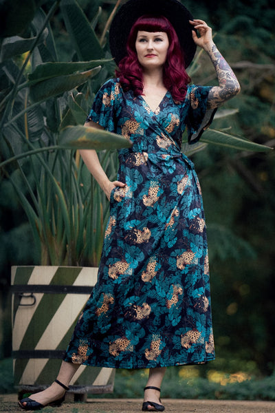 A model wearing an Isla Maxi Wrap Dress In Cheetah Jungle Print