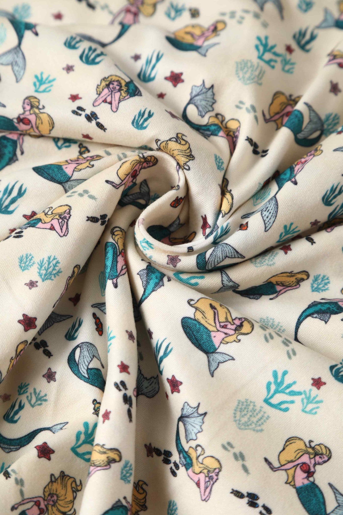 Close up view of Mermaid Wrap Dress In Ivory