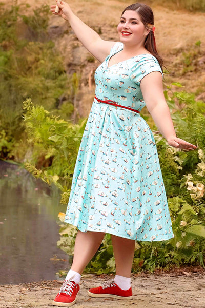 A lovely model in a Lily Message In A Bottle Off Shoulder Dress