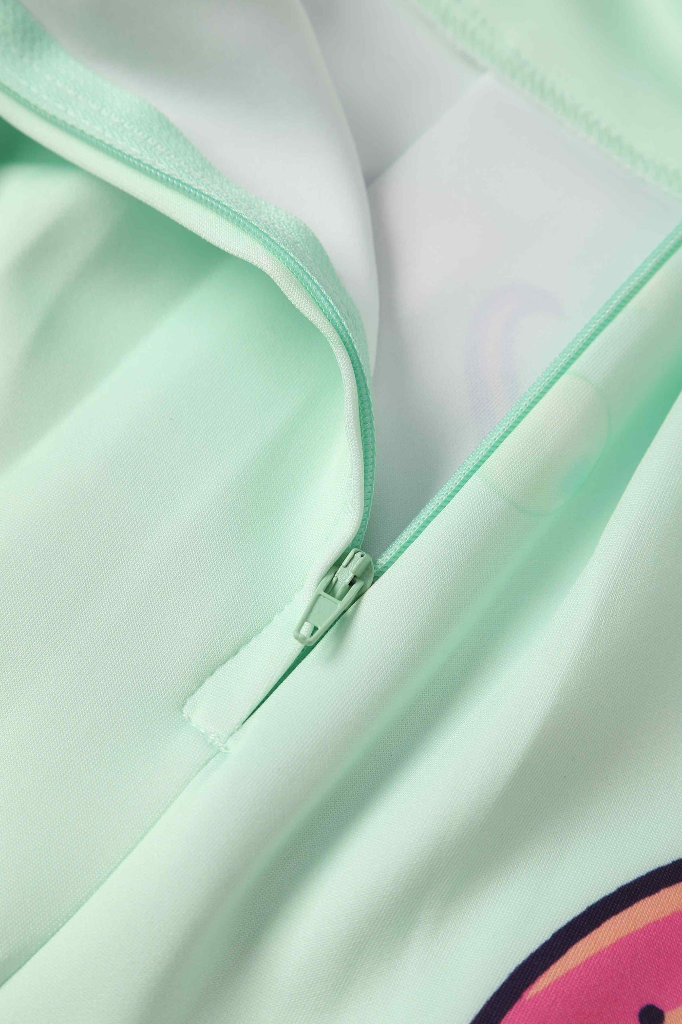 Close up View of mint green with octopus print box pleated skirt