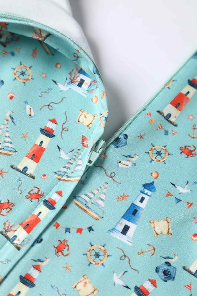 Close up view of Nautical Lighthouse Print Day Dress in Light Blue