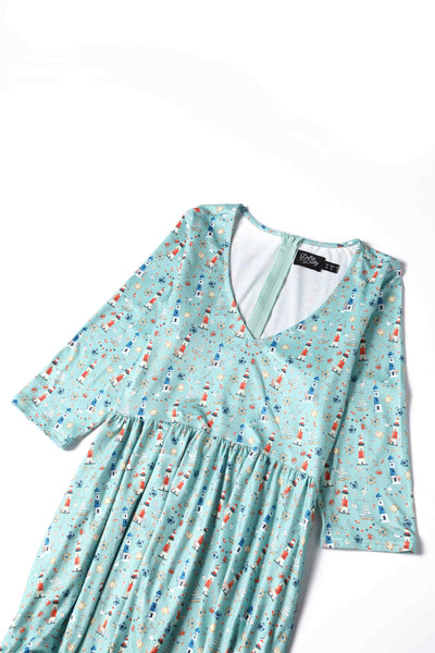 Close up view of Nautical Lighthouse Print Day Dress in Light Blue