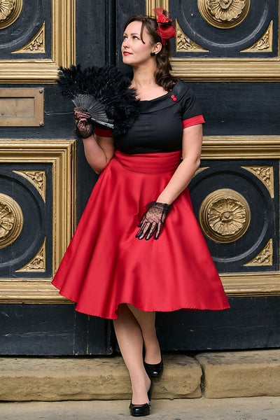 A charming model wearing a Navy & Burgundy Swing Dress