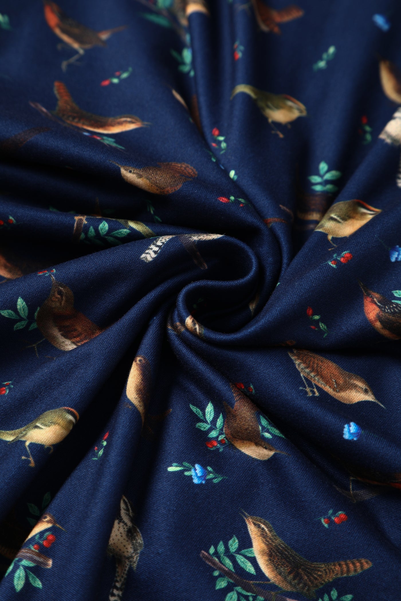 Close up view of navy blue bird print sleeved swing dress