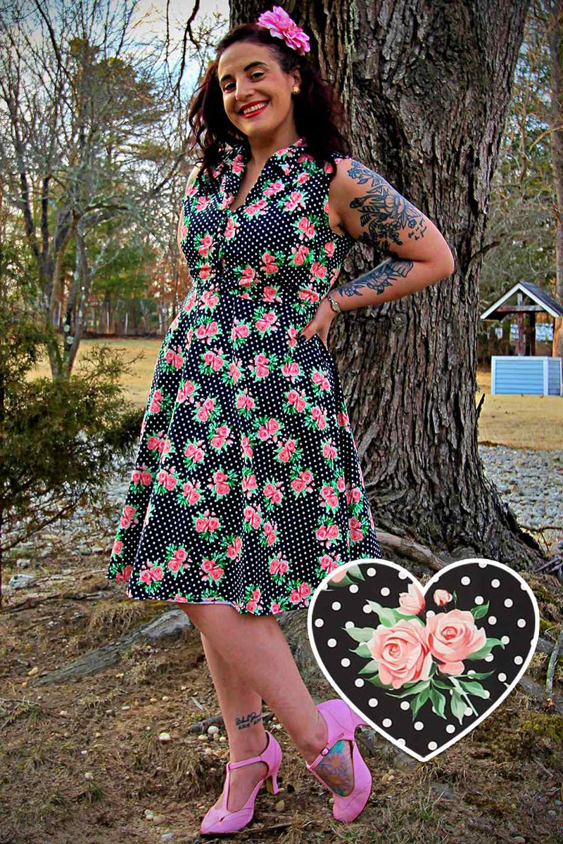A lady wearing a Navy Blue Polka Dot Rose Shirt Dress
