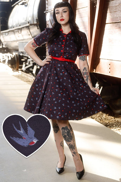 A model wearing Navy Blue Swallow Shirt Dress