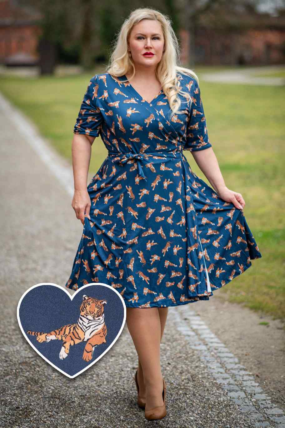 A model wearing Navy Blue Tiger Print Wrap Dress