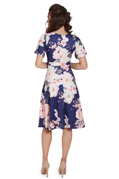 Model wearing  Navy Floral Petal Sleeve Tea Dress