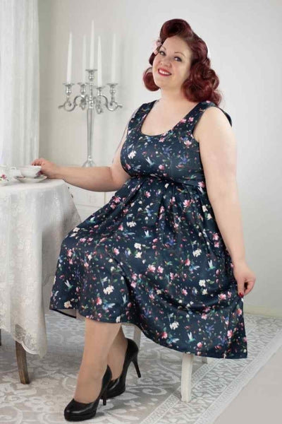 A model wearing a Navy Hummingbird Swing Dress