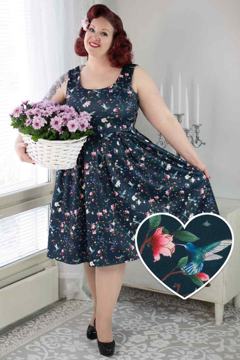 A model wearing a Navy Hummingbird Swing Dress