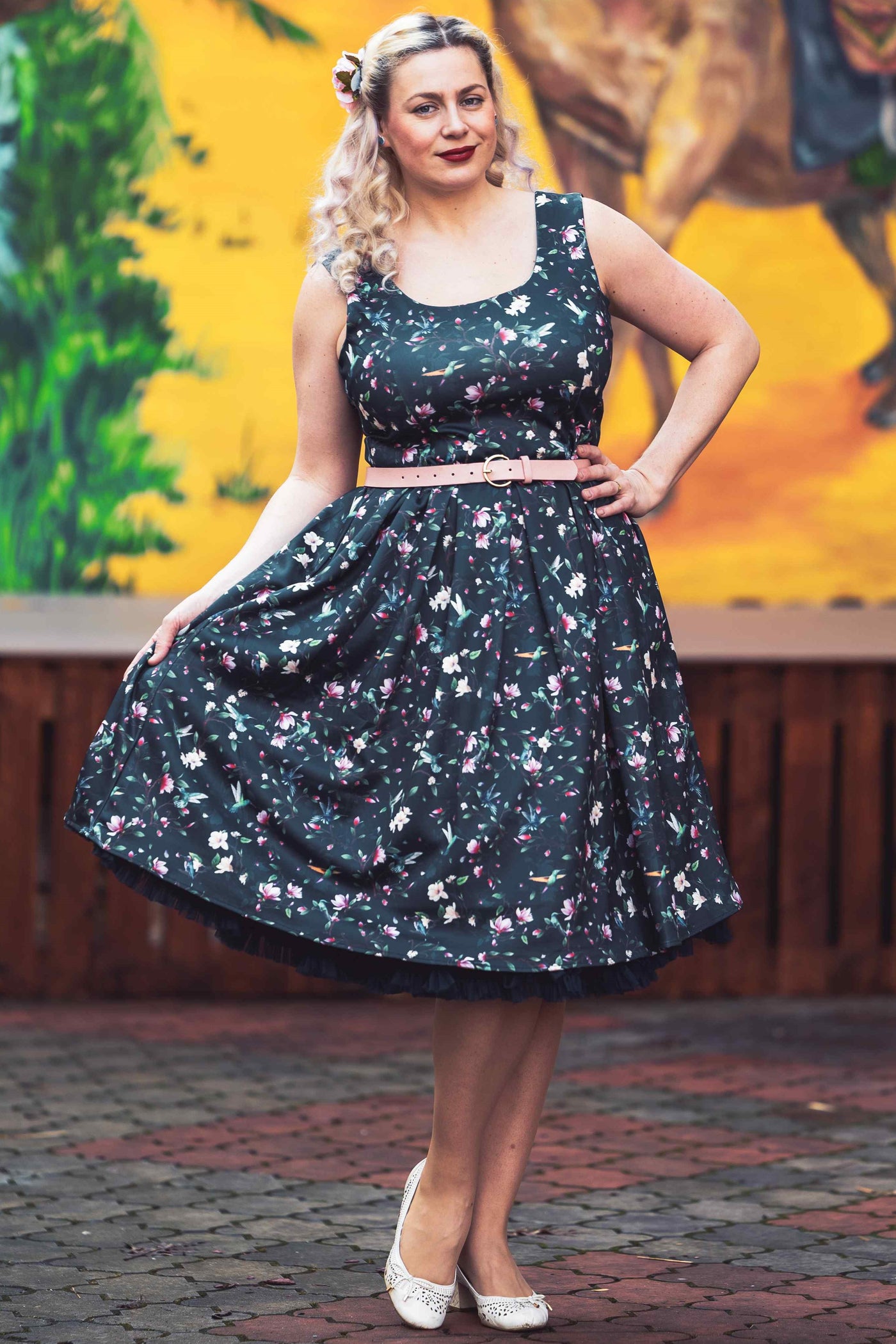 A model wearing a Navy Hummingbird Swing Dress